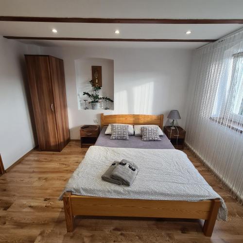 a bedroom with two beds in a room at Apartament OLTO Mikołajki in Mikołajki