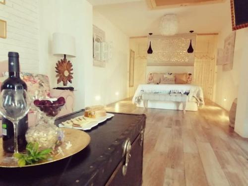 a large living room with a bed in the background at Estudio Jazmin in Nerja