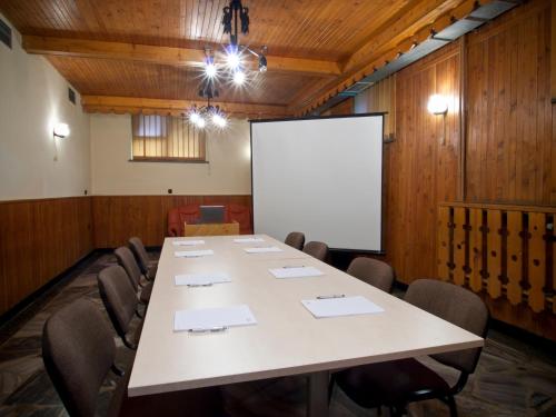 a conference room with a large table and chairs at Willa Orla in Zakopane