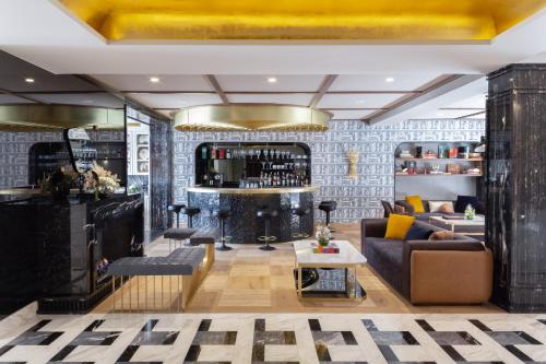 a living room with a couch and a table at The Alest Hotel in Mexico City