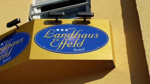 a blue and yellow sign on the side of a building at Landhaus Effeld in Wassenberg