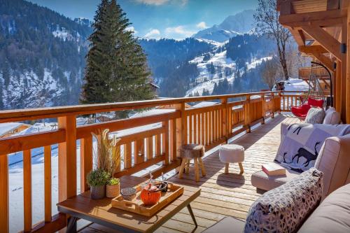 a balcony with a view of a snowy mountain at Chalet Sabaroc - OVO Network in La Giettaz