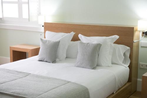 Postel nebo postele na pokoji v ubytování Hotel Boutique Palacio Corredera