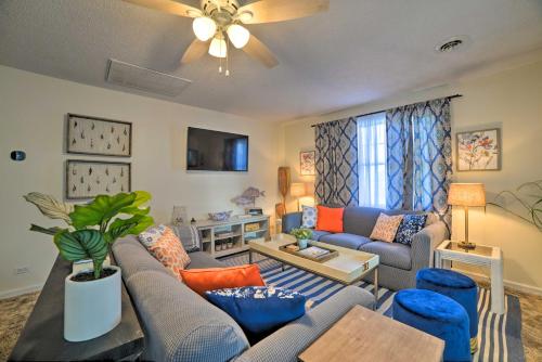 a living room with a couch and a table at Lakefront Moors Marina Condo with Covered Boat Slip! in Gilbertsville