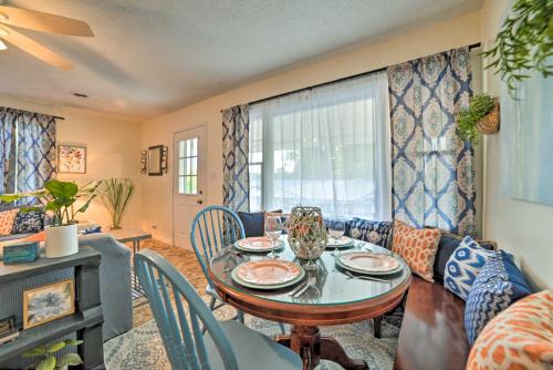 a living room with a table and a couch at Lakefront Moors Marina Condo with Covered Boat Slip! in Gilbertsville