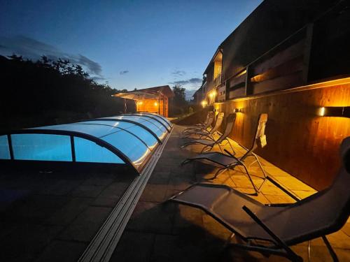 a row of swimming pools on the side of a building at Chata Sedloňov in Sedloňov