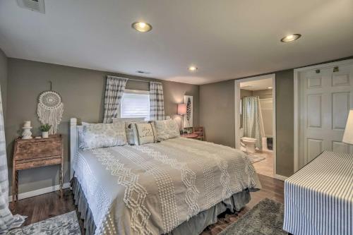 a bedroom with a white bed and a window at Damascus Cottage with Fire Pit - 1 Mi to Trails in Damascus
