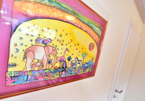 a painting of an elephant on a wall at Haus Mitti in Heinfels
