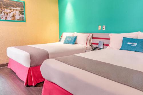 Кровать или кровати в номере Ayenda Frida Costa Azul