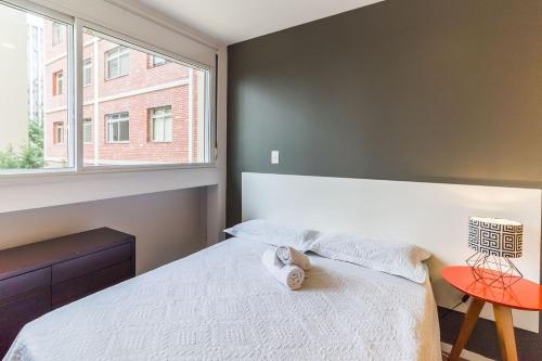 Cama o camas de una habitación en Studio moderno, novo, completo próximo Av Paulista