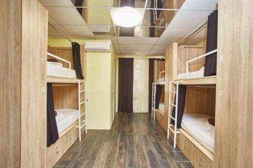 a corridor of a dorm room with bunk beds at Old Courtyard Hostel in Odesa