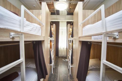 a group of bunk beds in a room at Old Courtyard Hostel in Odesa
