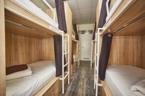 a row of bunk beds in a dorm room at Old Courtyard Hostel in Odesa