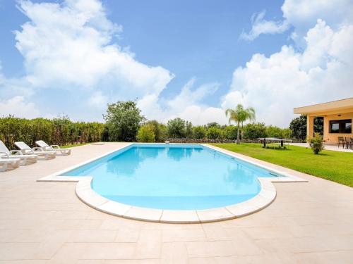 an image of a swimming pool in a house at Belvilla by OYO Dream villa with private pool in Solarino