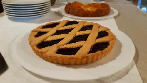 a pie on a white plate on a table at La Locanda nel Frutteto in Rovereto