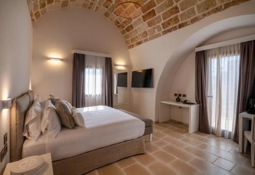 Postel nebo postele na pokoji v ubytování Masseria Corsano