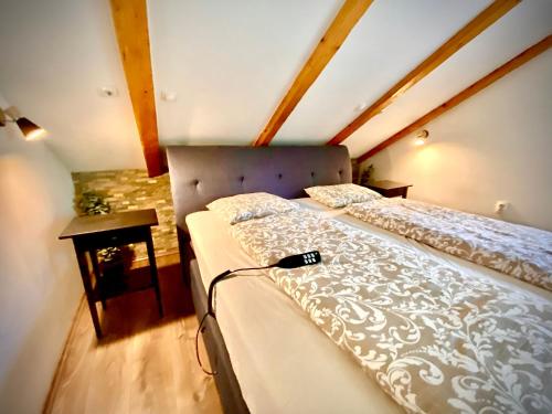 a bedroom with a bed in a attic at House by the River in Plitvica Selo