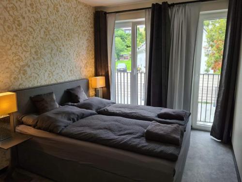 Tempat tidur dalam kamar di Villa Weisse Düne