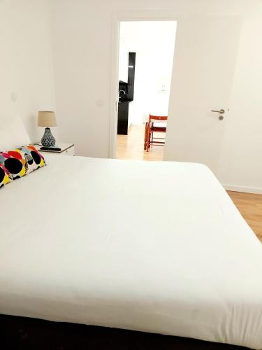 Ένα ή περισσότερα κρεβάτια σε δωμάτιο στο Residenza Dutzu - Aparthotel Leiria