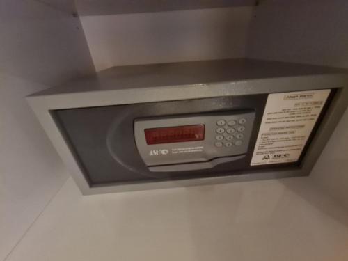 a microwave oven on a wall in a hotel room at סוויטת נור Noor Suite in Majdal Shams