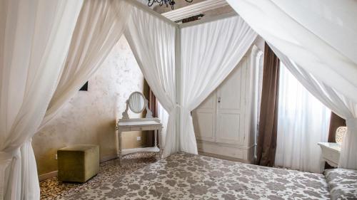Postel nebo postele na pokoji v ubytování Locanda Casa Martini