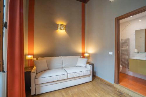 a living room with a white couch in a room at B&B Repubblica in Florence