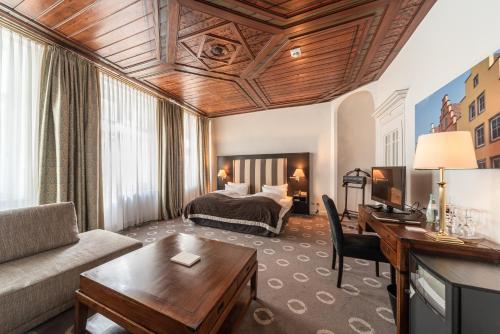 Postel nebo postele na pokoji v ubytování Romantik Hotel Walhalla
