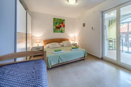 Posteľ alebo postele v izbe v ubytovaní Elena Apartments