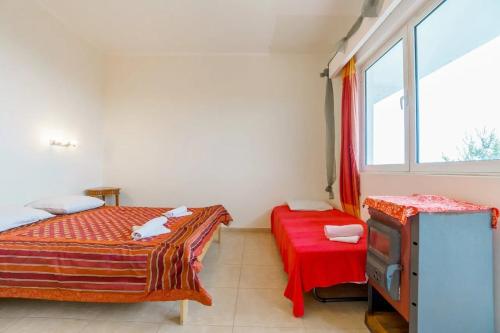 Postel nebo postele na pokoji v ubytování Yoga & Apartment Zlata Oliva