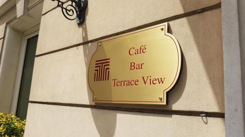 a sign on the side of a building at Tmark Hotel Vaticano in Rome