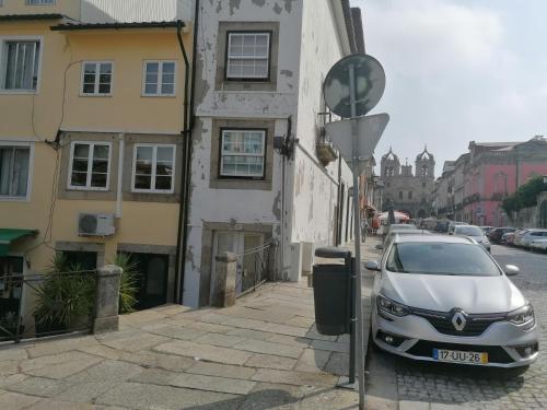 a car parked on a street next to a building at Historic House in Braga