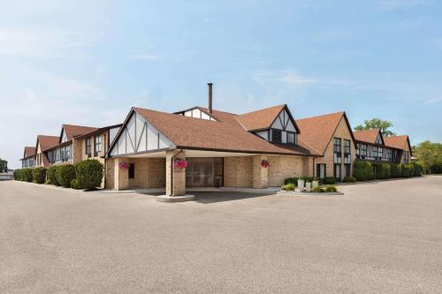 a row of houses in a parking lot at Days Inn by Wyndham Sarnia Harbourfront in Sarnia