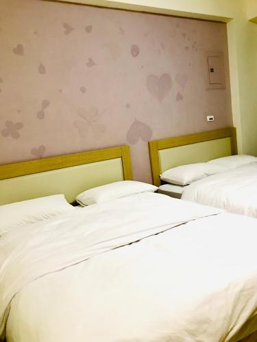 Ein Bett oder Betten in einem Zimmer der Unterkunft 民宿記 Min su ji