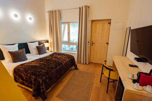 Letto o letti in una camera di Balvanyos Resort - Peakture Hotel & Grand Hotel Balvanyos