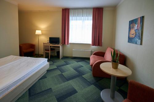 Postel nebo postele na pokoji v ubytování Kolonna Hotel Rēzekne
