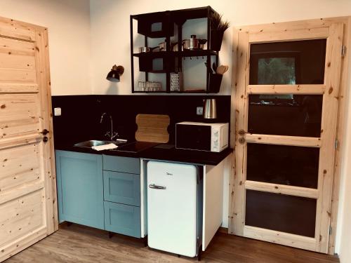 Una cocina o zona de cocina en Apartmány Kunc