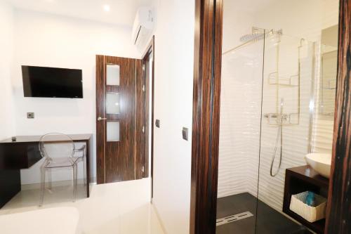 a bathroom with a toilet and a sink and a shower at Casa el Cielo Spainsunrentals 1184 in El Molino