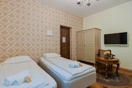 Una cama o camas en una habitación de KUBU namai