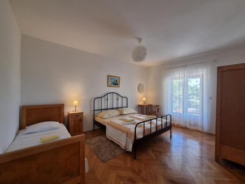 Postel nebo postele na pokoji v ubytování Cozy apartments with seafront terraces