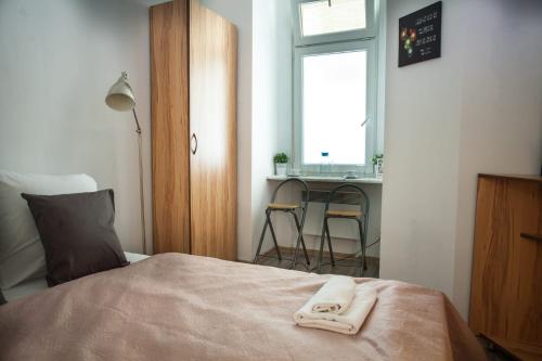 Postel nebo postele na pokoji v ubytování Cozy studio in the center for 2 people