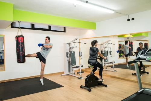 a group of people exercising in a gym at EcoHotel Ristorante Milano in Borgo a Mozzano