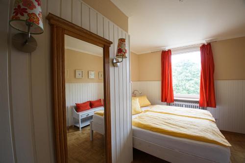 Кровать или кровати в номере Oland Whg11 Sünnenkieker