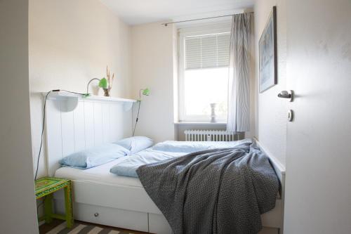מיטה או מיטות בחדר ב-Oland Whg 14 Nordseetraum
