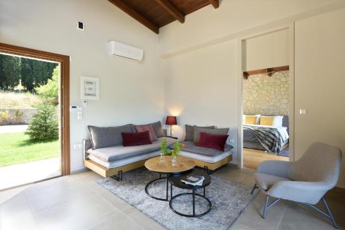 a living room with a couch and a table at Amfikleia Chalet in Amfikleia