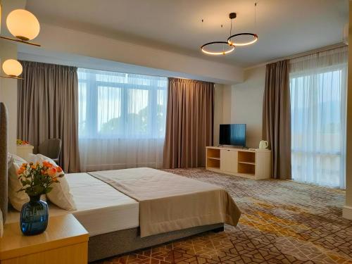 Een bed of bedden in een kamer bij HOTEL CITRUS