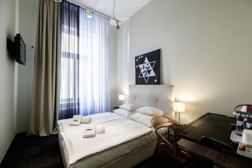 Кровать или кровати в номере Home Aparthotel