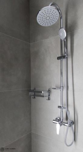 a shower with a shower head in a bathroom at Corfu Garden Villas in Corfu
