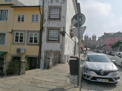 a silver car parked on the side of a street at Historic House in Braga