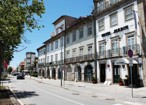 a street with a building on the side of the road at Hotel Jardim Viana do Castelo in Viana do Castelo