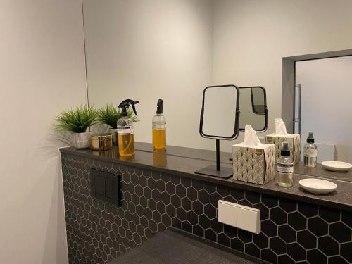 a bathroom with a counter with a mirror and a sink at Amstel Boutique Studio in Amsterdam